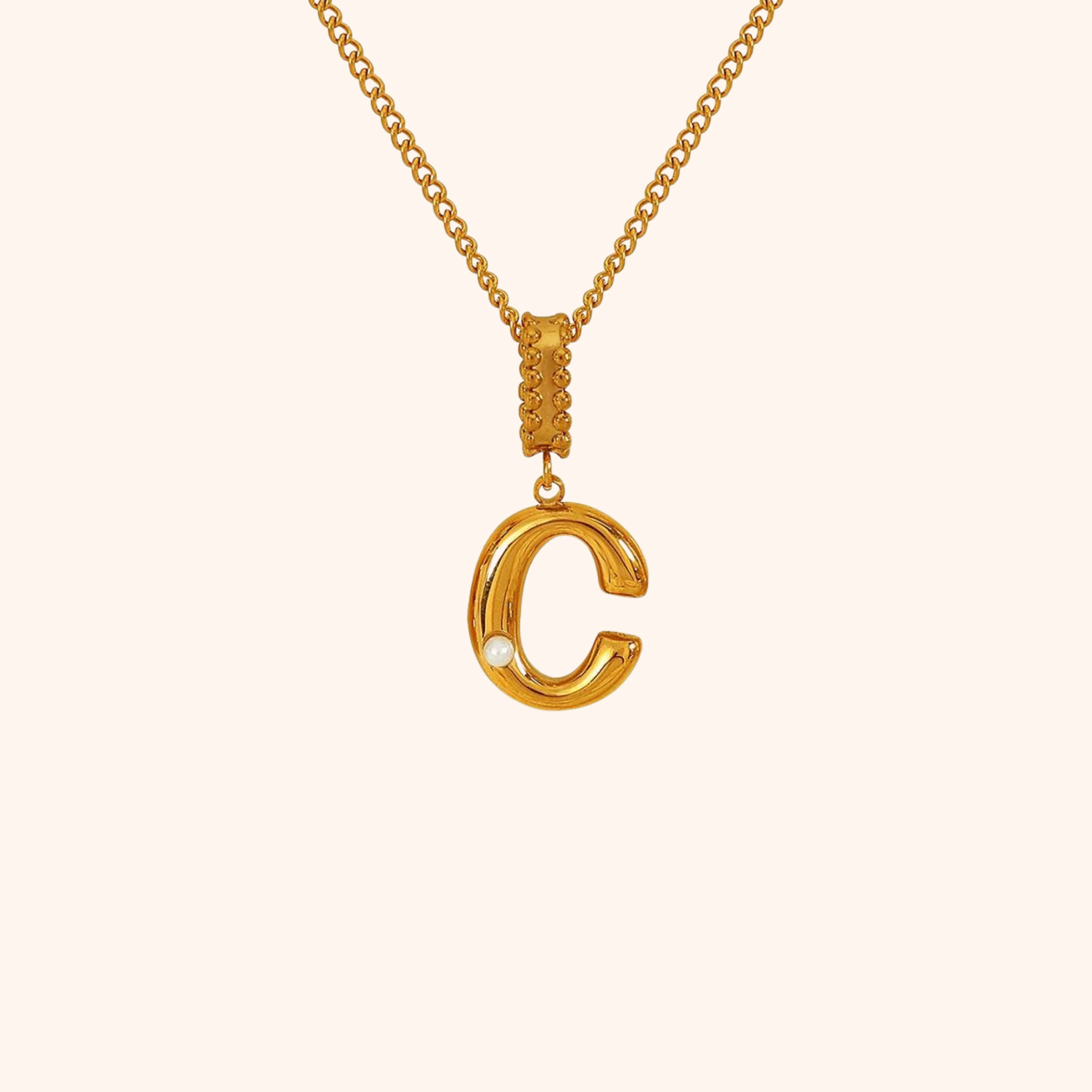 Gold-plated letter C necklace featuring a singular pearl